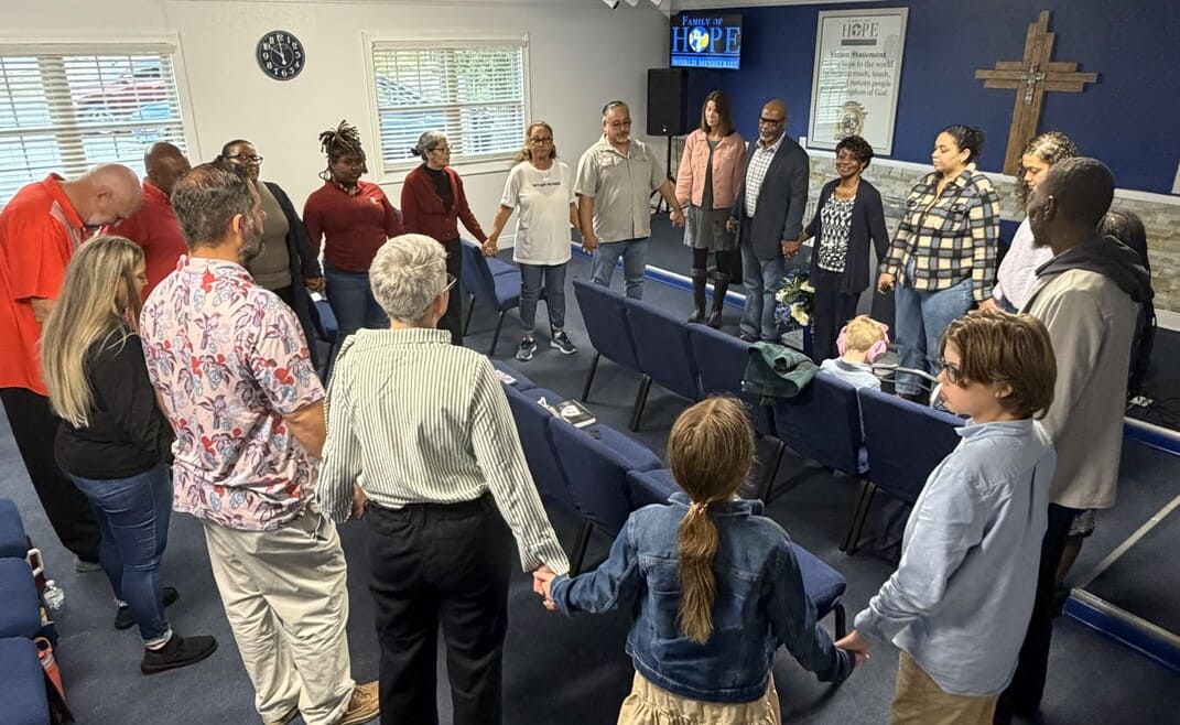 Group prayer at Family of Hope World Ministries